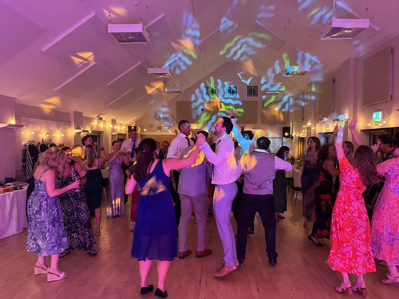 Guests dancing on a packed dance floor at a Mobile Disco Network event